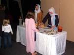 Young person checks out the jewelry selection.