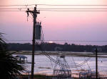 Setting sun over Murrells Inlet seen from Trina's balcony at 7:03 as evening shadows gather on September 25, 2007.