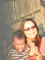 Vi holds our new little friend, Joshua Lopez.