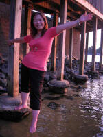 Vi steps off into the lake.