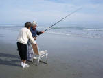 Mother watches Daddy check the bait.