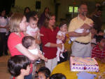 Quintuplets with the girls' birthday cake