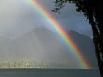 View toward the historic Lake Quinault Lodge, South Shore of Lake Quinault, with Olympic National Forest illuminated.