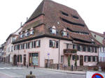 Medieval (1448) salthouse (Maison du Sel), its distinctive enormous roof overlooking one of the canals threading through downtown.